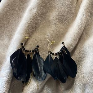 Icing earrings brand new haven’t worn. Black feathers with little gold chains